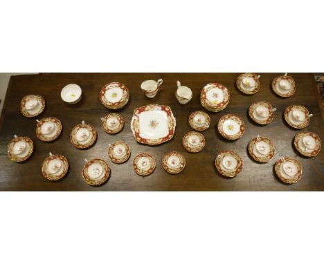 A Paragon "Pompadour" pattern part tea service comprising 18 plates, 17 saucers, 14 teacups, 6 coffee cups and saucers, 2 cre