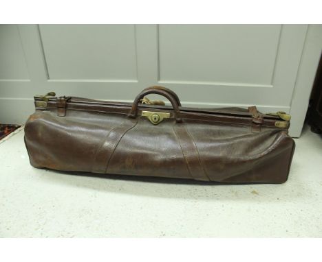 A vintage leather and brass embellished cricket bag of Gladstone style