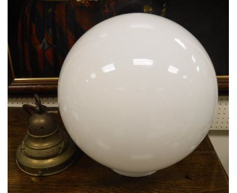 An Art Deco style ceiling light with plain milk glass globe on a brass suspension fitting CONDITION REPORTS Diameter is appro