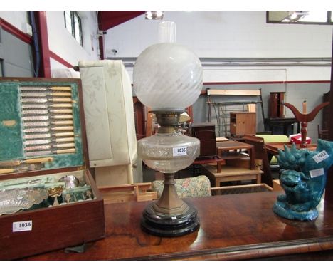 A Victorian "Duplex" oil lamp with etched floral shade and glass reservoir