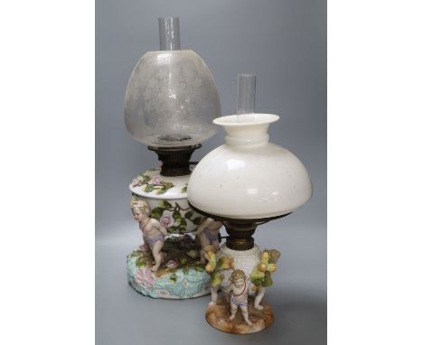 A Sitzendorf porcelain oil lamp and another similar smaller oil lamp, tallest 54cm including including shade and chimneyCONDI