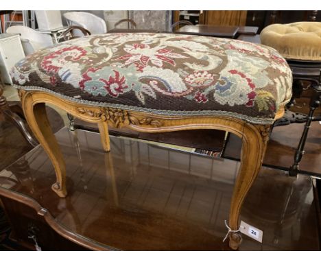 A Louis XVI style walnut dressing stool with tapestry seat, width 76cm, depth 46cm, height 50cm