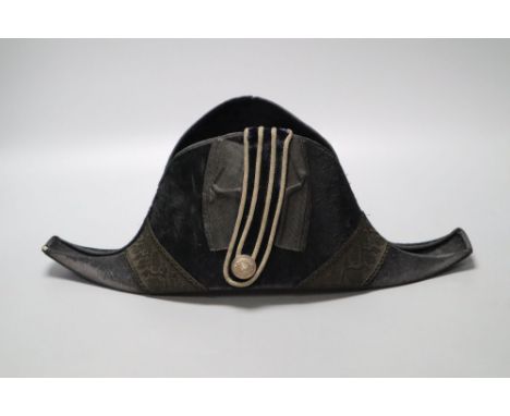 A WWI bicorn naval hat with Kings crown button