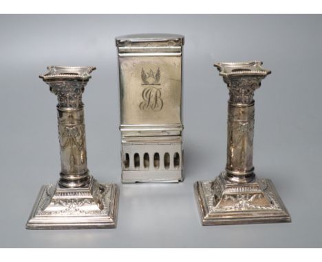 A pair of Victorian plated and embossed dwarf candlesticks and a Victorian plated pocket lamp, height 24cm (3)