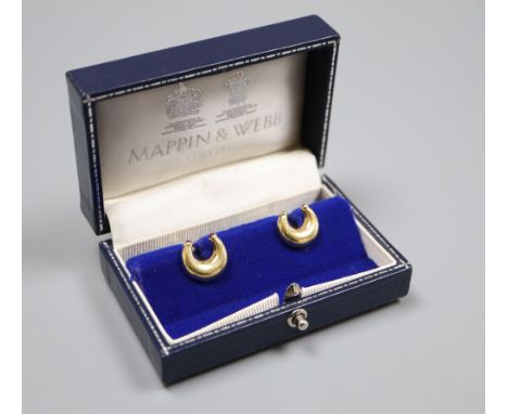 A pair of modern 18ct gold and ruby set horseshoe shaped cufflinks by Mappin &amp; Webb, London, 1989, horseshoe 14mm, gross 