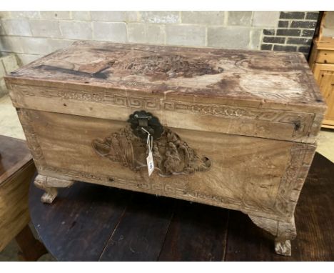 A Chinese carved camphorwood trunk, width 92cm depth 48cm height 51cm
