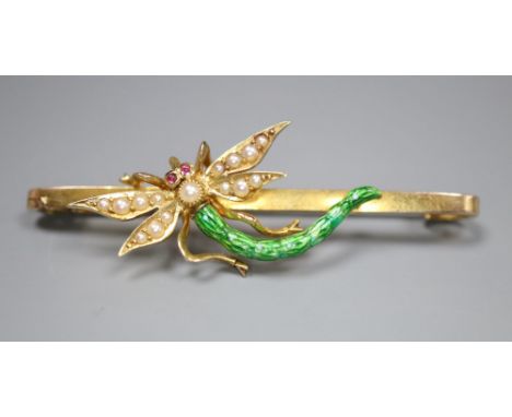 An Edwardian yellow metal, garnet?, seed pearl and green enamel set dragonfly bar brooch, 51mm, gross 6.7 grams.CONDITION: So