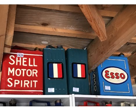 A collection of four Vintage petrol cans hand painted Shell Motor Spirit Esso and two with French flags (4)