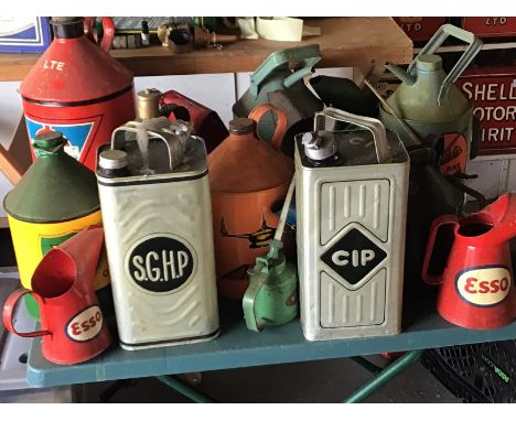 A collection of Vintage hand painted oil jugs and oil cans Esso BP Aladdin CIP and others.