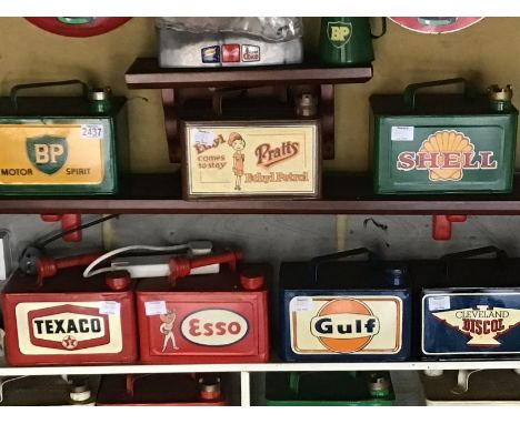 A collection of seven 5 litre Vintage hand painted Petrol cans BP Esso Gulf Texaco Shell Prats and Cleveland Discol (7)