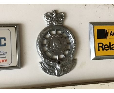 A collection of Vintage Car AA badges and RAC badges.