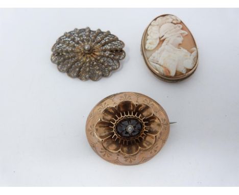 A collection of yellow metal and silver antique brooches. Including a yellow metal garnet and seed pearl Victorian mourning b