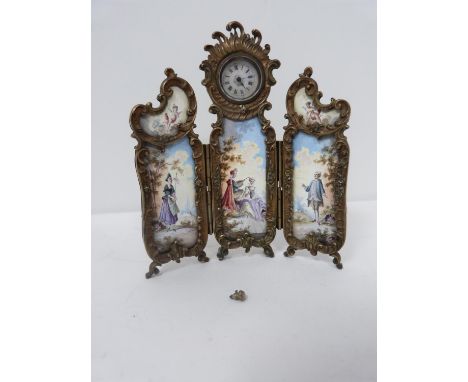 An antique gilt silver Austrian enamel miniature triptych clock. Winder for the hands has come loose and key end has broken o