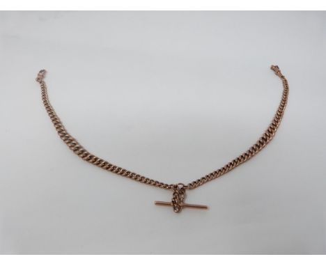A 9 carat yellow hollow gold double Albert chain with T-Bar. Links graduate in size and each one stamped 9ct. Length 40cm. We