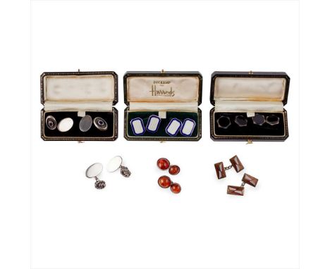 ? A collection of cufflinks to include a pair of silver cufflinks with blue and white guilloche enamel detail; a pair of onyx