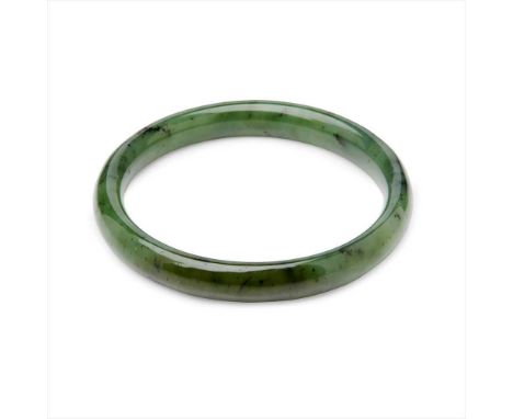 A nephrite bangle of plain circular form (Dimensions: Internal diameter:  70mm)(Internal diameter:  70mm)Condition report: Go