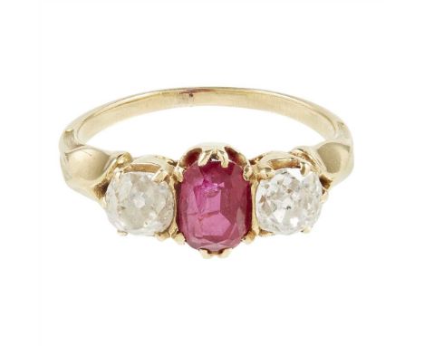 A Burmese ruby and diamond set ring claw set with an oval-cut ruby, flanked to either side by an old cushion-cut diamond, unm