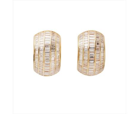 A pair of French 18ct diamond set earrings each of curved design, composed of five rows of graduated baguette-cut diamonds, t