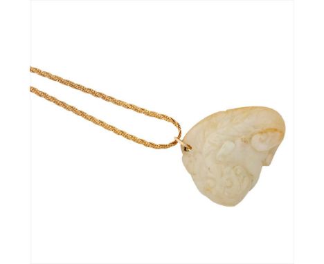 A mutton fat jade pendant necklace the pendant with carved detail, to a fancy link chain stamped 20k (Dimensions: Pendant: 35