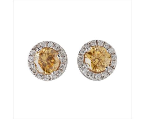 A pair of yellow and colourless diamond set cluster earrings each claw set with a round brilliant-cut yellow diamond, in a bo