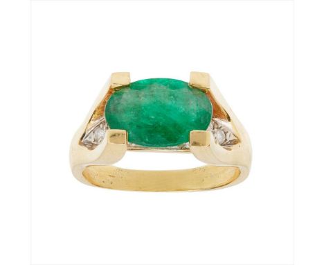 An emerald and diamond set ring claw set with an oval-cut emerald above a pavé set band of round brilliant-cut diamonds, to a