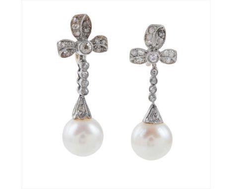 A pair of early 20th century pearl and diamond set pendant earrings each modelled as a bow, millegrain set with rose-cut diam