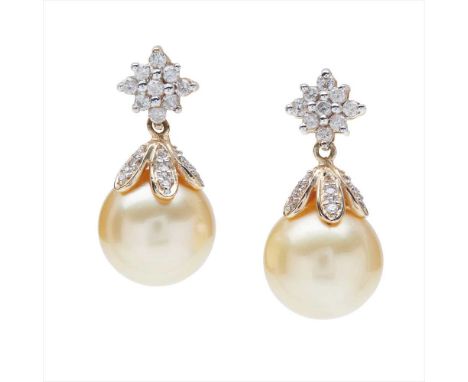 A pair of pearl and diamond set earrings each composed of a cluster of nine round brilliant-cut diamonds, suspending a golden