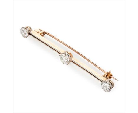 A three stone diamond set bar brooch claw set with three old round-cut diamonds, to a plain bar brooch, unmarked (Dimensions: