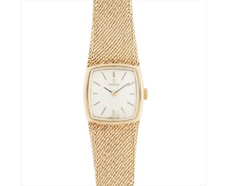 A l970s lady's 9ct gold wrist watch, Omega the slight rounded square dial of satin silver finish, baton indicators, with an i