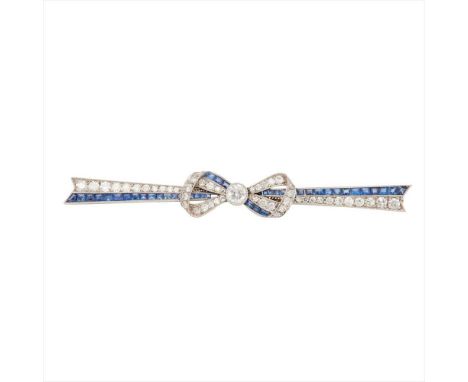 An early 20th century diamond and sapphire set bar brooch modelled as a bow, millegrain set with an old round-cut diamond to 