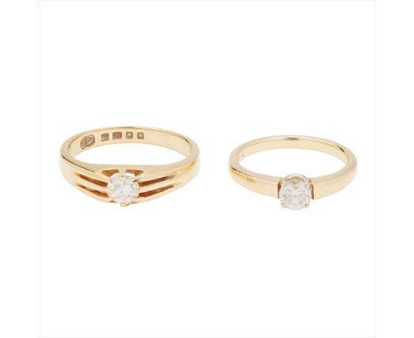 A single stone diamond set ring claw set with a round brilliant-cut diamond, to a plain 18ct yellow gold shank; together with