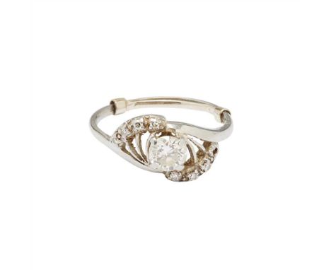A diamond set ring claw set with an old round-cut diamond, in a fanned border of four eight-cut diamonds to each side (one la