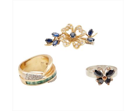 A sapphire and diamond set brooch modelled as a floral spray, claw set with a round-cut sapphire, the petals pavé set with ro