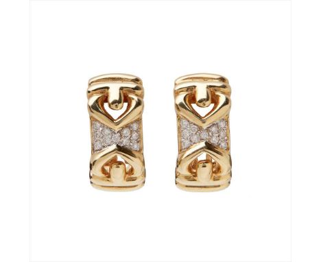 A pair of diamond set earrings each composed of a vertical panel pavé set with round brilliant-cut diamonds with pierced styl