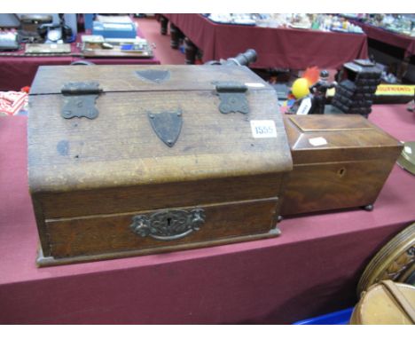 A George III Mahogany Tea Caddy, of sarcophagus form, boxwood stringing, raised on bun feet, and an early XX Century oak slop