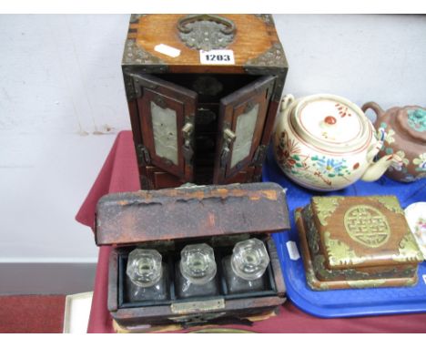 An Early XX Century Travelling Set, with three glass stoppered bottles, in damaged morocco case featuring Egyptian head; Orie