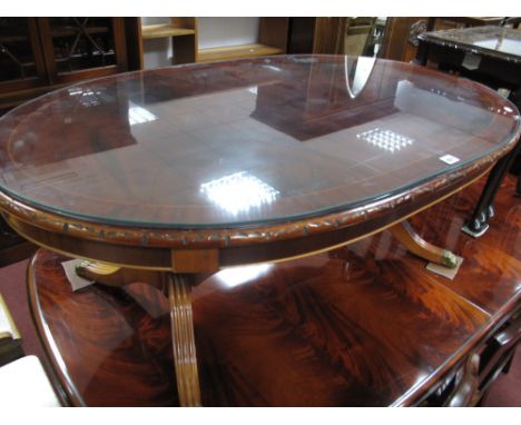 A Glass Oval Topped Mahogany Coffee Table, on twin tripod legs, nest of coffee tables. (2)