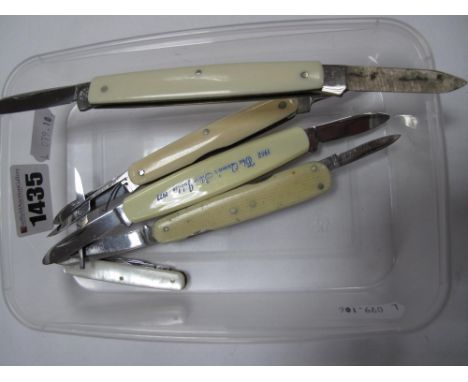 A Multifunction Folding Pocket Knife, comprising two blades and scissors, stamped "Witness", with plain scales; a William Rod