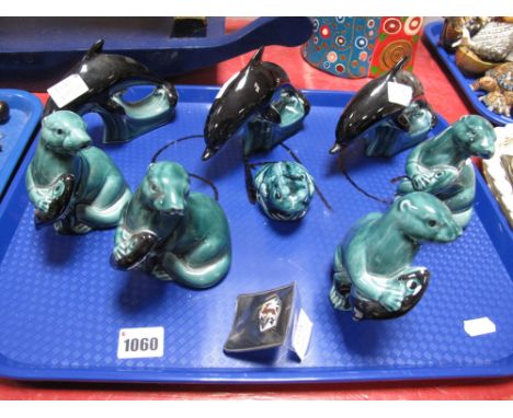 A Collection of Three Poole Pottery Small Dolphins, in turquoise and black glazes, printed marks, 15cm long; together with a 