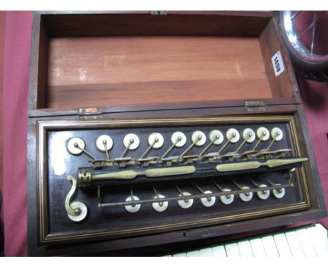 A Victorian Accordion/Melodianne, stamped  'Busson of Paris', with mother of pearl buttons and keys, in original pine box.
