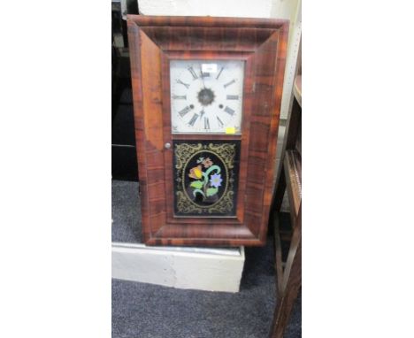 An American walnut cased wall clock by Jerome, with thirty hour gong striking movement.
