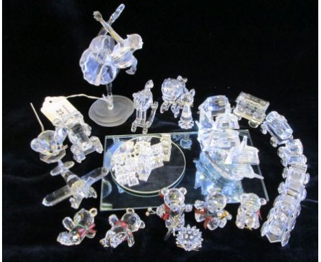 A collection of Swarovski When We Were Young, including Aeroplane, Ballerina, Kris Bear Celebration, Kris Bear on skates, Kri