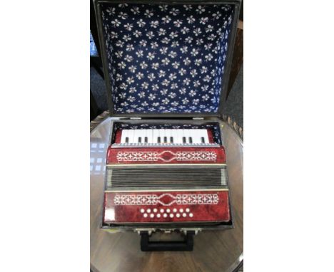 An almost 'as new' Russian sixteen button piano accordion