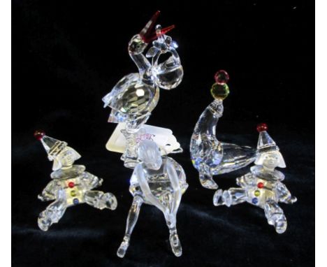 A collection of Swarovski Cheerful Time, including Ballerina (young), Seal (playing/juggling), Stork with Baby (659401), Pupp