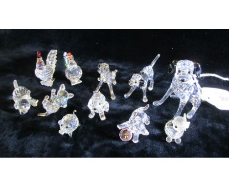 A collection of Swarovski, Peaceful Countryside, including Beagle puppy playing, Beagle puppy sitting, Cat (mini floppy tail)