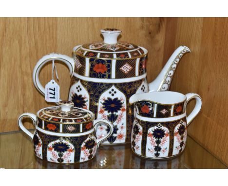 ROYAL CROWN DERBY IMARI THREE PIECE TEA SERVICE, pattern 1128, comprising an oval shape teapot, dated 1985/1986, height 18cm,