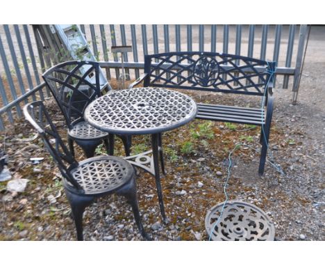 FOUR ITEMS OF CAST ALUMINIUM GARDEN FURNITURE including a round table, a pair of chairs and a bench. Condition Report: paint 