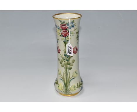 A WILLIAM MOORCROFT FOR MACINTYRE VASE with a tube lined forget-me-not and rose patterns on a celadon ground, of cylindrical 
