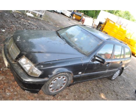 A 1998 MERCEDES C240 ESPRIT FIVE DOOR ESTATE CAR FOR SPARES OR REPAIRS in black with a 2398cc petrol engine, automatic gearbo