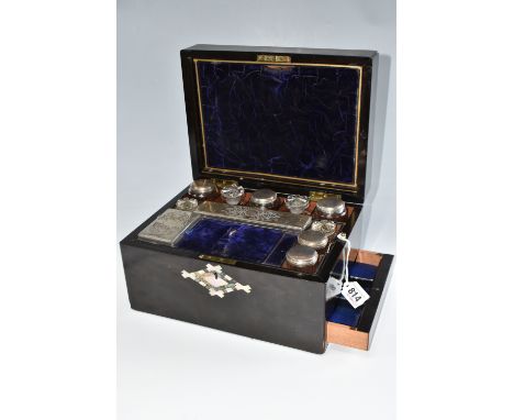 A NINETEENTH CENTURY LADIES' TRAVEL VANITY CASE, possibly coromandel with mother of pearl inlay to the cover and escutcheon, 